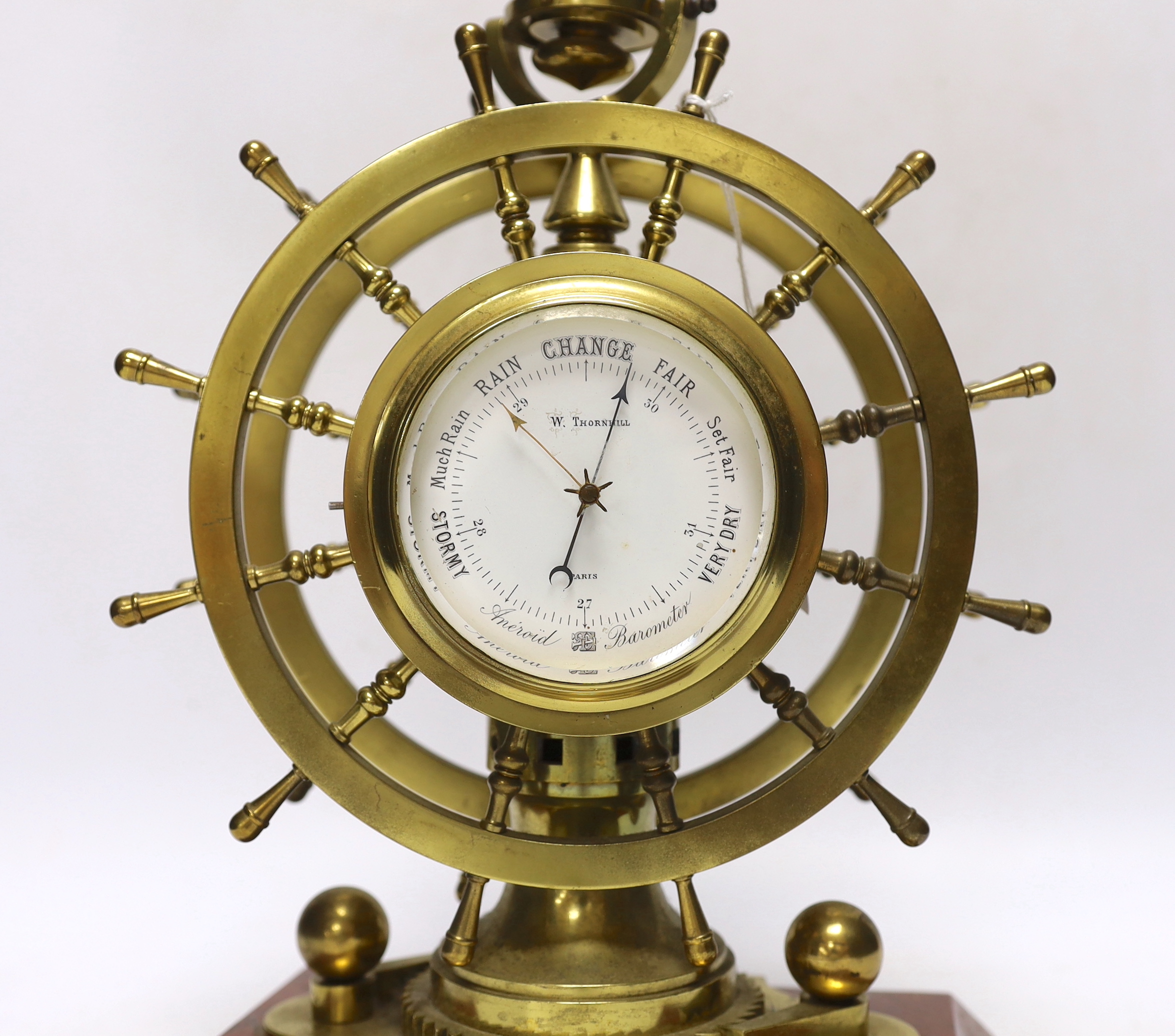 A late Victorian brass and marble ship's wheel timepiece with aneroid barometer and compass, 29.5cm